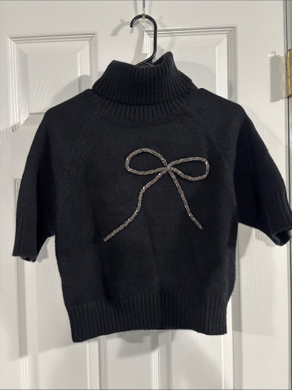 Anthropologie Black Short-Sleeve Turtleneck Sweater with Bow Accent